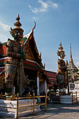 Bangkok Grand Palace, pair of statues of demons (yakshas) gatekeepers of the entrances in the western gallery of the Temple of the Emerald Buddha (Wat Phra Kaew).